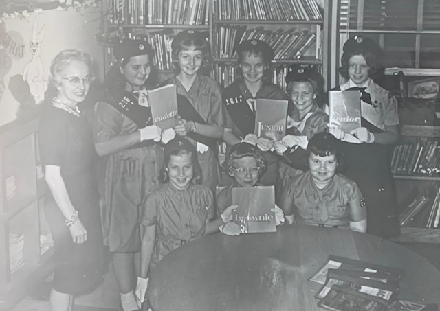 Girl Scouts meeting in the library